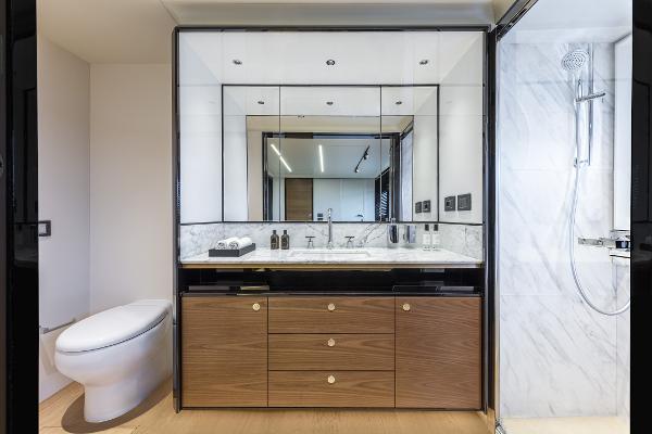 Slide: The Image of Luxurious bathroom in 2024 Absolute Navetta 64 yacht with modern fixtures and marble accents. - 18