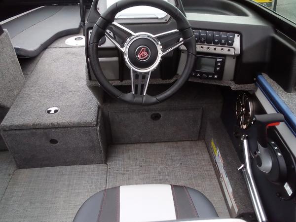 Slide: The Image of 2022 Alumacraft Edge 175 Sport boat interior with steering wheel and control panel. - 6