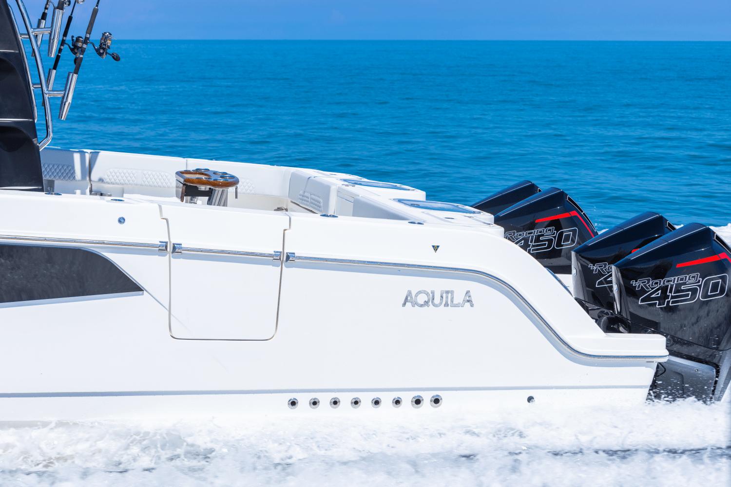 Slide: The Image of 2024 Aquila 47 Molokai boat with quad Racing 450 engines on the ocean. - 1