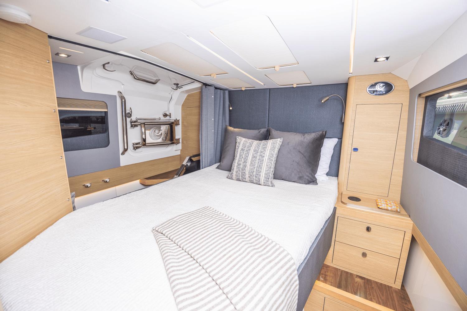 Slide: The Image of Luxurious bedroom interior of 2024 Aquila 47 Molokai yacht with modern design. - 13