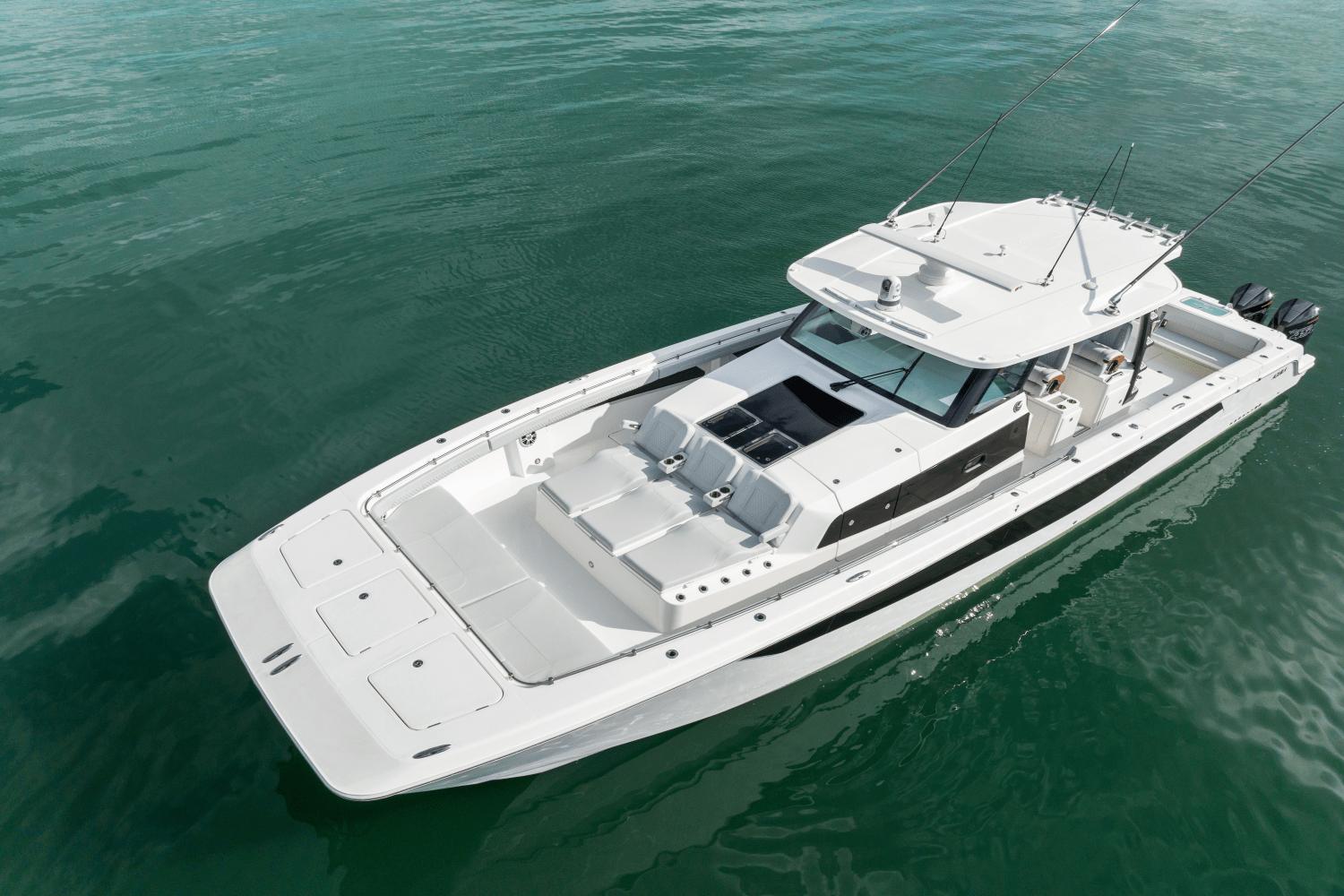Slide: The Image of 2024 Aquila 47 Molokai boat on calm water. - 4
