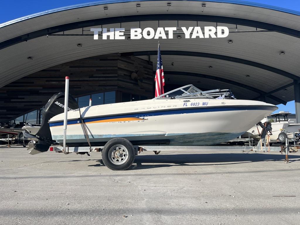 Slide: The Image of 2004 Bayliner 175 boat on trailer at The Boat Yard, with American flag. - 1