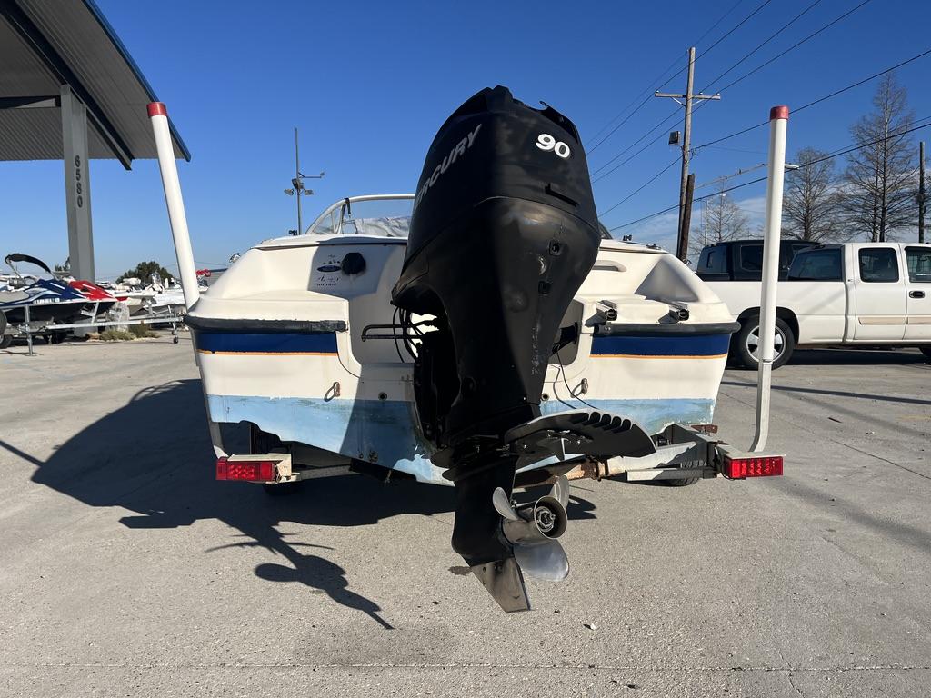 Slide: The Image of 2004 Bayliner 175 boat with Mercury 90 outboard motor on a trailer. - 5