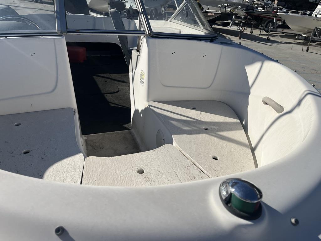 Slide: The Image of 2004 Bayliner 175 boat interior with seating and open deck view. - 9