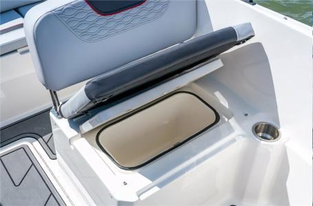 Slide: The Image of 2024 Bayliner Element M19 boat with open storage compartment under seat. - 2