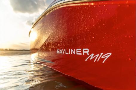 Slide: The Image of 2024 Bayliner Element M19 boat in water at sunset. - 4