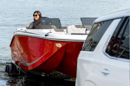 Slide: The Image of 2024 Bayliner Element M19 boat being launched into water. - 8