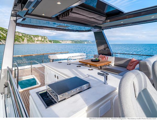 Slide: The Image of Luxurious 2025 Beneteau Grand Trawler 62 yacht with spacious deck and stunning ocean view. - 14
