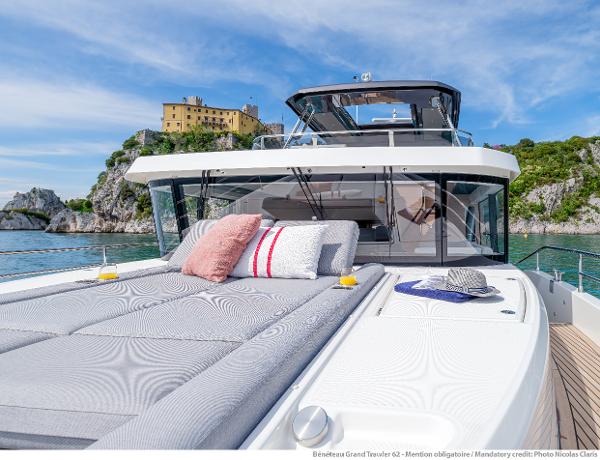 Slide: The Image of 2025 Beneteau Grand Trawler 62 yacht with luxurious deck, scenic coastal backdrop. - 19