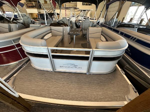 Slide: The Image of 2023 Bennington 22SSR pontoon boat interior with plush seating and modern design. - 0