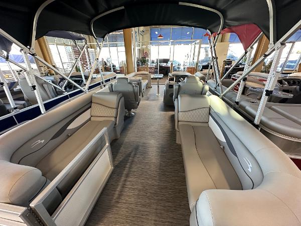 Slide: The Image of 2023 Bennington 22SSR pontoon boat interior with spacious seating and canopy. - 1