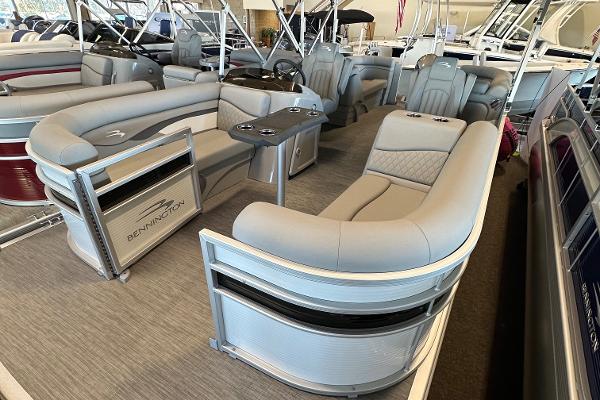 Slide: The Image of 2023 Bennington 22SSR pontoon boat interior with luxurious seating and modern design. - 10