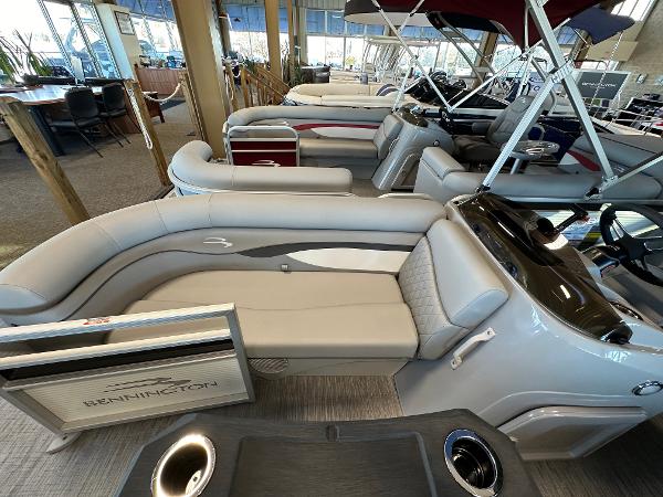 Slide: The Image of 2023 Bennington 22SSR pontoon boat interior with luxurious seating and modern design. - 2