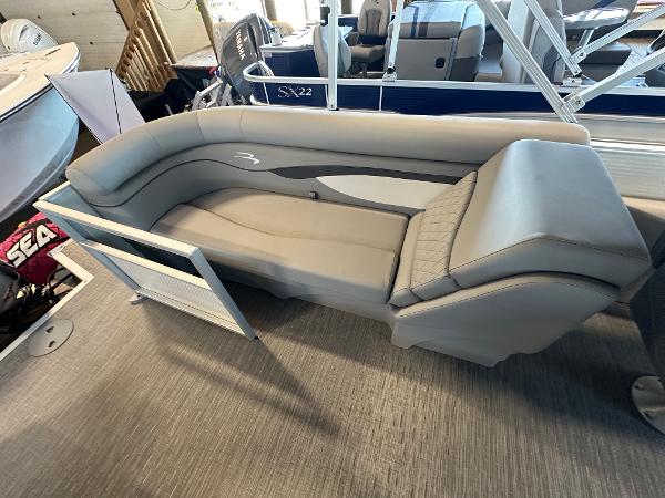 Slide: The Image of 2023 Bennington 22SSR boat interior with gray seating and open gate. - 4