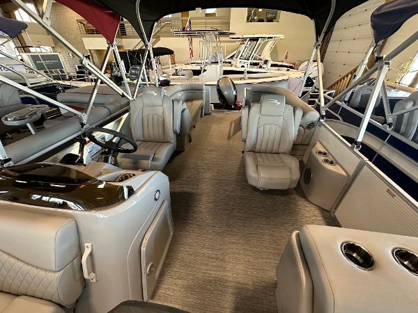 Slide: The Image of 2023 Bennington 22SSR pontoon boat interior with luxurious seating and modern design. - 5