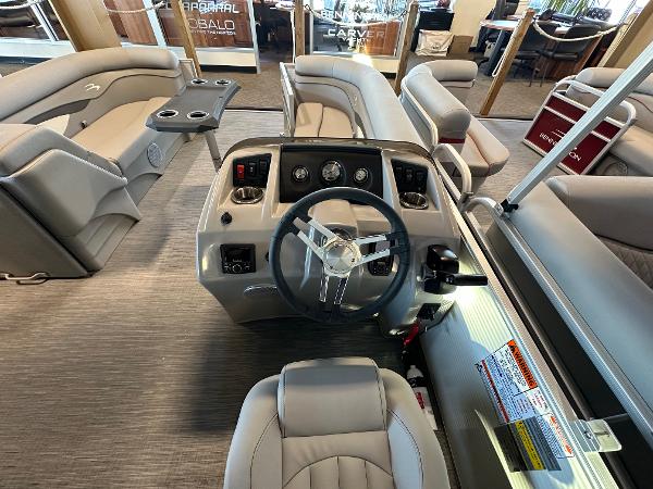 Slide: The Image of 2023 Bennington 22SSR boat interior with steering console and seating. - 6