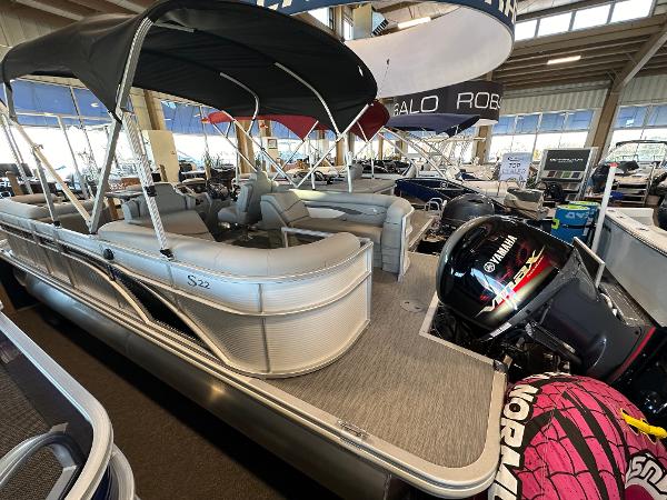 Slide: The Image of 2023 Bennington 22SSR pontoon boat with Yamaha outboard motor in showroom. - 8