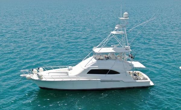 Slide: The Image of 2005 Bertram 570 yacht on clear blue water. - 0
