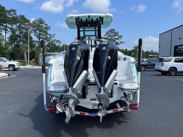 Slide: The Image of 2024 Blackfin 272 CC boat with dual outboard engines, rear view. - 3