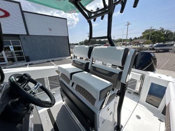 Slide: The Image of 2024 Blackfin 272 CC center console boat interior with dual seating and steering wheel. - 8