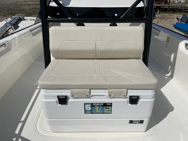 Slide: The Image of Boston Whaler 210 Montauk 2023 boat with Igloo cooler and cushioned seat. - 9