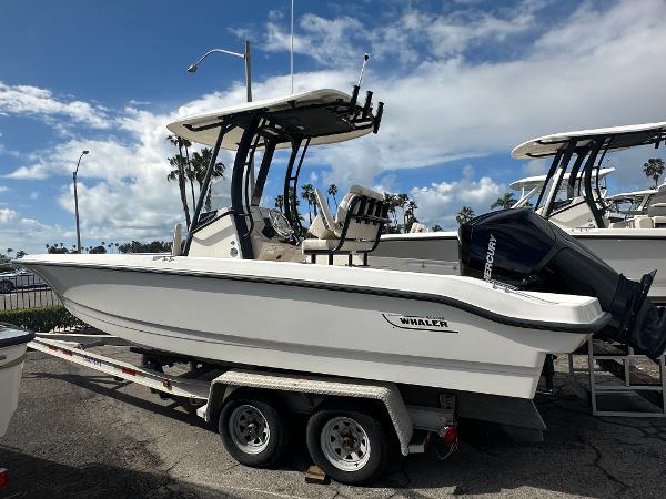 Slide: The Image of 2024 Boston Whaler 220 Dauntless boat on a trailer, side view. - 0
