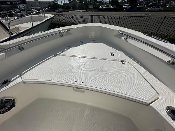 Slide: The Image of 2024 Boston Whaler 220 Dauntless boat bow with storage compartments. - 10
