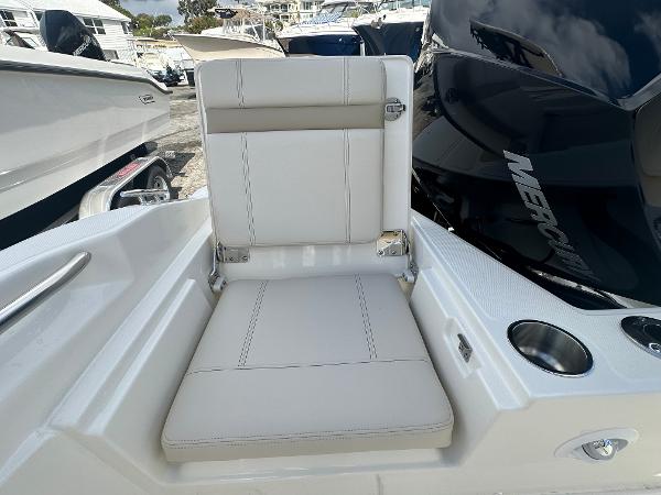 Slide: The Image of 2024 Boston Whaler 220 Dauntless boat seat and Mercury engine. - 3