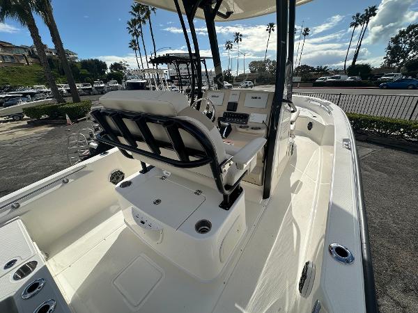 Slide: The Image of 2024 Boston Whaler 220 Dauntless boat interior with helm and seating. - 4