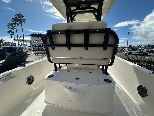 Slide: The Image of 2024 Boston Whaler 220 Dauntless boat interior with seating and storage. - 5