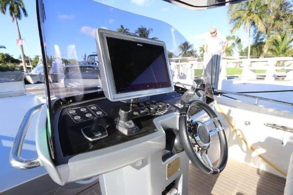 Slide: The Image of Helm of 2018 Canados Gladiator 428 with navigation screen and controls. - 2