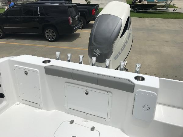 Slide: The Image of 2024 Cape Horn 22OS boat stern with Suzuki outboard motor and rod holders. - 5