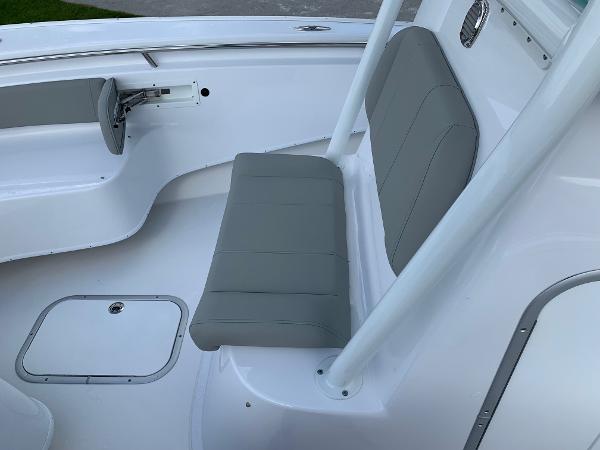 Slide: The Image of 2024 Cape Horn 24 XS boat interior with gray seating and white deck. - 14