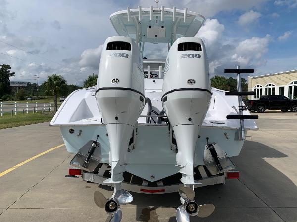 Slide: The Image of 2024 Cape Horn 24 XS boat with twin 200 HP engines, rear view. - 2
