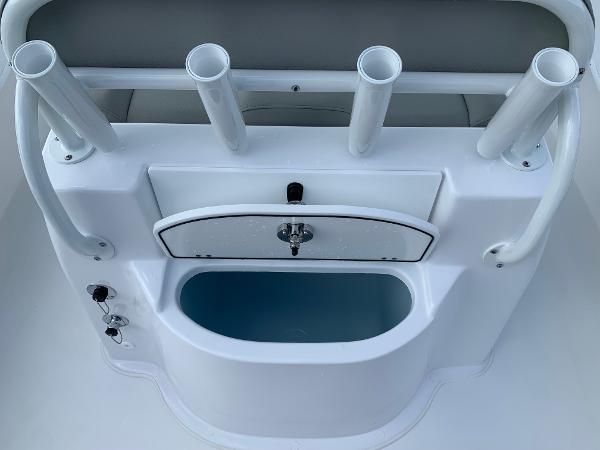 Slide: The Image of 2024 Cape Horn 24 XS boat console with rod holders and storage compartment. - 7