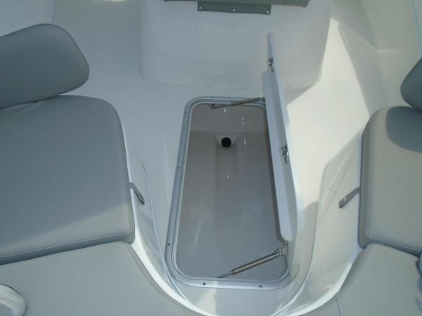 Slide: The Image of 2024 Cape Horn 27XS boat interior storage compartment with open hatch. - 11