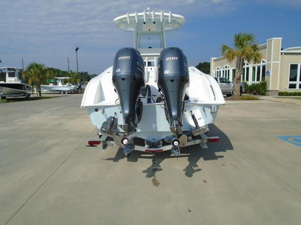 Slide: The Image of 2024 Cape Horn 27XS boat with twin 200 horsepower engines, rear view. - 2