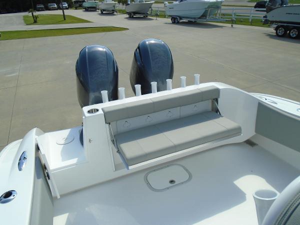 Slide: The Image of 2024 Cape Horn 27XS boat with dual outboard motors and rear seating. - 5