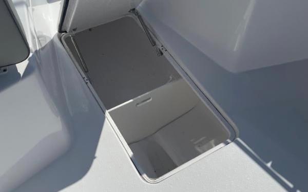 Slide: The Image of Open storage compartment on a 2024 Cape Horn 34 XS boat. - 29
