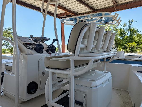 Slide: The Image of 2022 Carolina Skiff 21 SWS boat interior with seating and rod holders. - 13