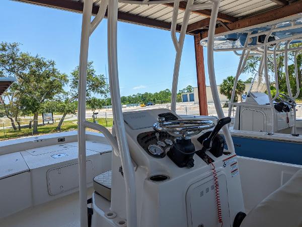 Slide: The Image of 2022 Carolina Skiff 21 SWS boat interior with steering console and seating. - 8