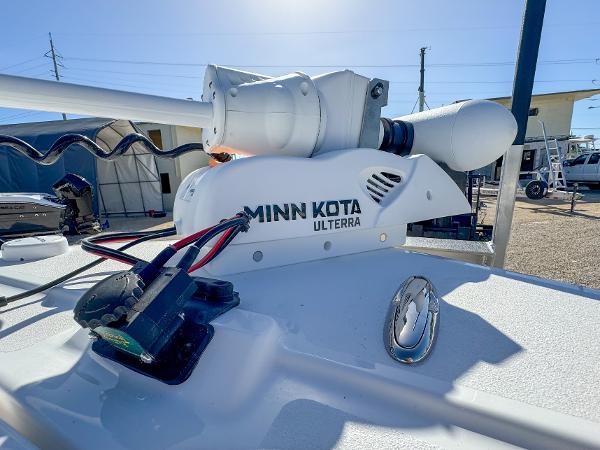 Slide: The Image of Minn Kota Ulterra motor on 2024 Caymas 28 HB boat, outdoor setting. - 26