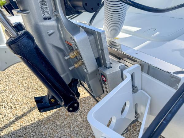 Slide: The Image of Close-up of 2024 Caymas 28 HB boat engine mount and hydraulic system. - 34