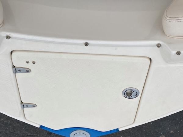 Slide: The Image of 2018 Chaparral 224 Sunesta boat storage compartment. - 32