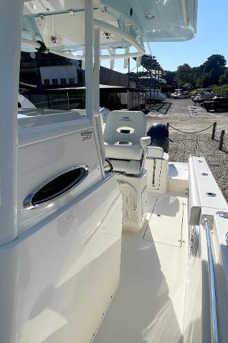 Slide: The Image of 2024 Cobia 262cc boat interior with seating and console. - 16