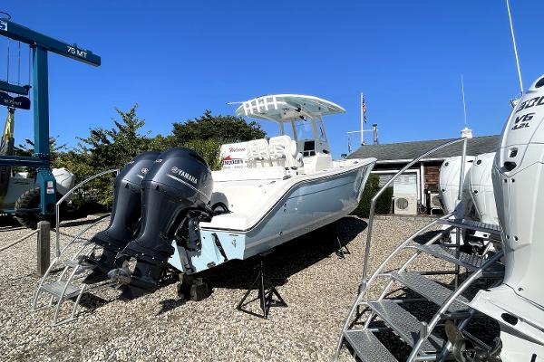 Slide: The Image of 2024 Cobia 262cc boat with twin Yamaha engines on display. - 4
