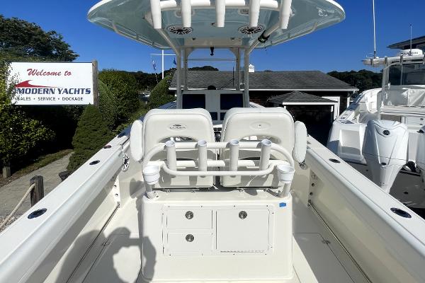 Slide: The Image of 2024 Cobia 262cc boat at Modern Yachts dealership. - 6