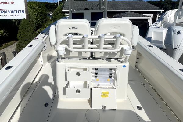 Slide: The Image of 2024 Cobia 262cc center console boat with rod holders and storage compartments. - 7