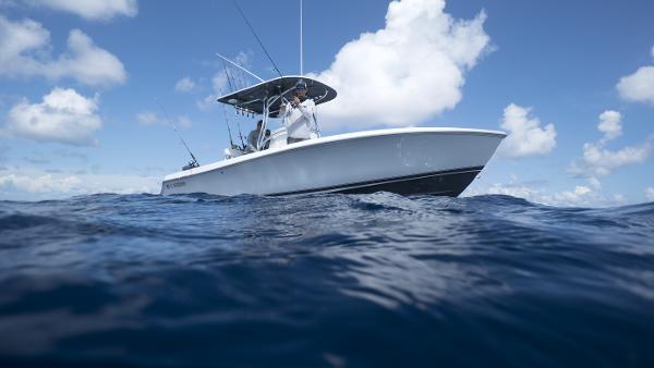 Slide: The Image of 2024 Contender 24S boat on open water under blue sky. - 4