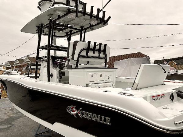Slide: The Image of 2023 Crevalle 26 HBW boat with black and white exterior. - 4
